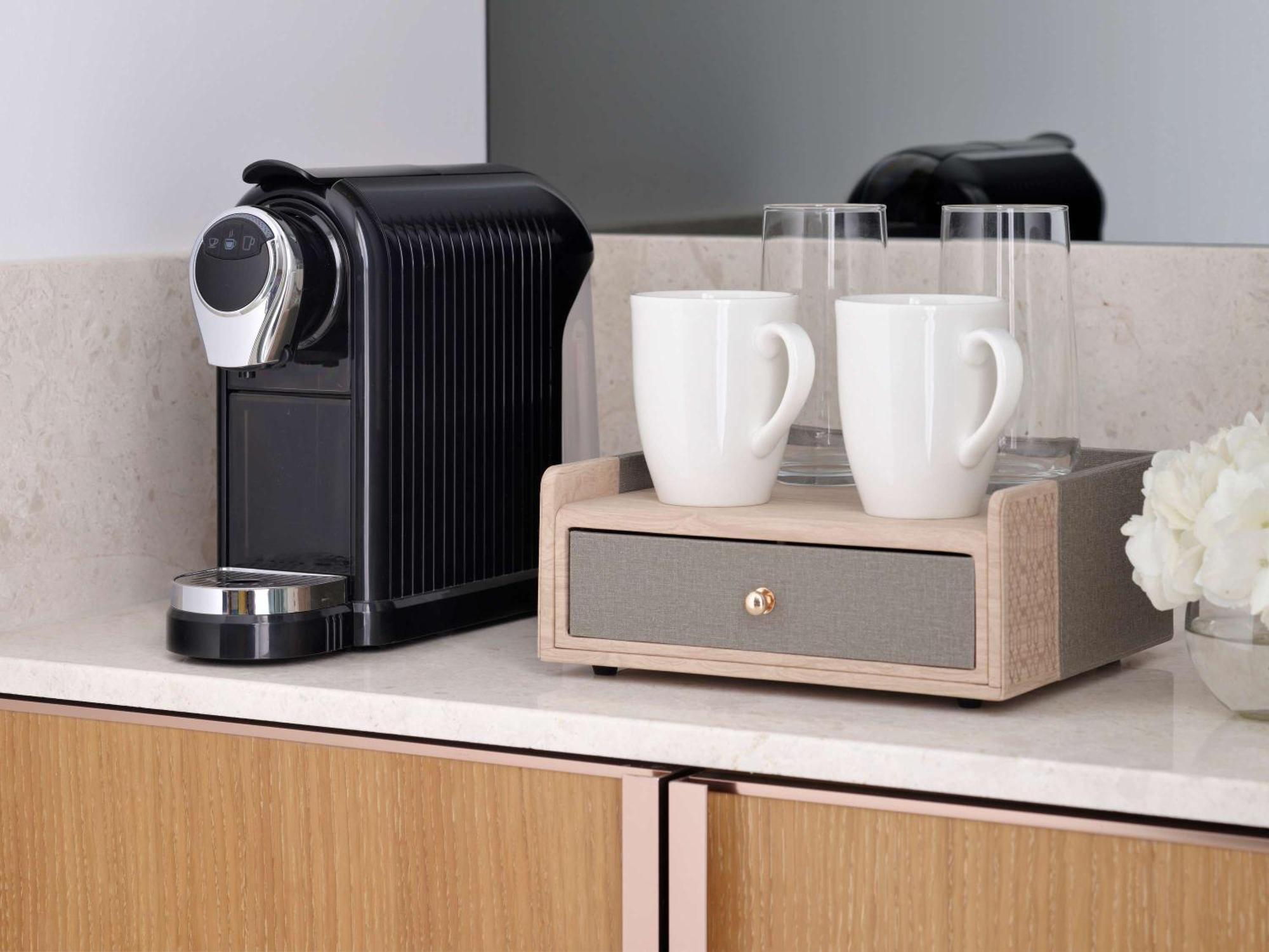 Moevenpick Hotel & Apartments Ghala Mascate Exterior foto A Nespresso coffee machine